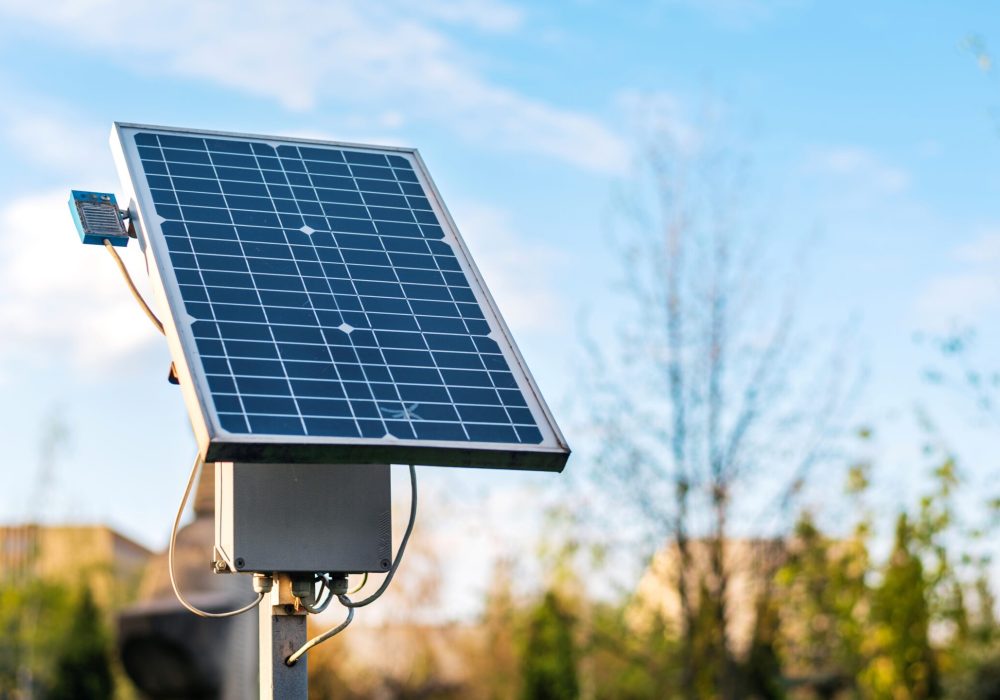 Close view of a solar panel with nature on the background